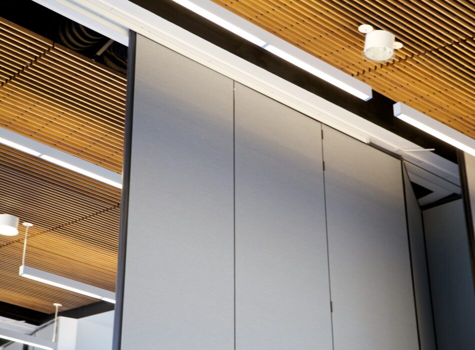 Gray floor-to-ceiling partitions in a modern room.